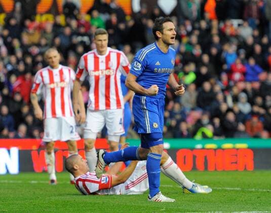 Frank Lampard of Chelsea FC London celebrates as own goal scorer Jonathan Walters of Stoke City lies on the ground - Barclays Premier League - Stoke City vs Chelsea - Britannia Stadium - Stoke on Trent - 12 01 13 - Picture Simon Bellis Sportimage EDITORIAL USE ONLY. No use with unauthorised audio, video, data, fixture lists, club league logos or live services. Online in-match use limited to 120 images, no video emulation. No use in betting, games or single club league player publications.