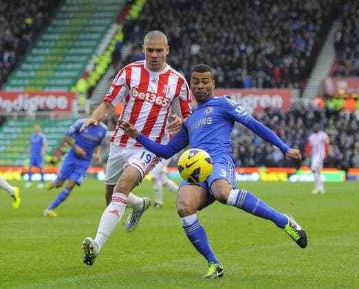 Ashley Cole of Chelsea FC London gets a cross in past Jonathan Walters of Stoke City - Barclays Premier League - Stoke City vs Chelsea - Britannia Stadium - Stoke on Trent - 12 01 13 - Picture Simon Bellis Sportimage EDITORIAL USE ONLY. No use with unauthorised audio, video, data, fixture lists, club league logos or live services. Online in-match use limited to 120 images, no video emulation. No use in betting, games or single club league player publications.
