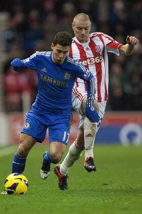 Football - 2012 2013 Premier League - Stoke City vs. Chelsea FC London Stoke s Andy Wilkinson chases Eden Hazard of Chelsea FC London at the Britannia Stadium 