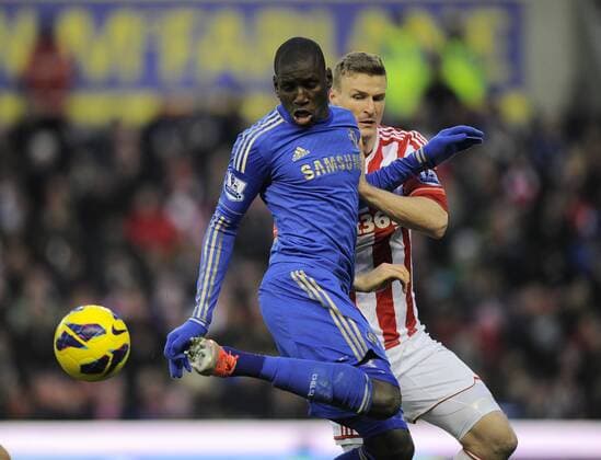 Demba Ba of Chelsea FC London flicks the ball past Robert Huth of Stoke City - Barclays Premier League - Stoke City vs Chelsea - Britannia Stadium - Stoke on Trent - 12 01 13 - Picture Simon Bellis Sportimage EDITORIAL USE ONLY. No use with unauthorised audio, video, data, fixture lists, club league logos or live services. Online in-match use limited to 120 images, no video emulation. No use in betting, games or single club league player publications.