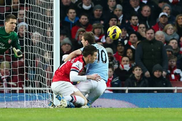Football - 2012 2013 Premier League - FC Arsenal London vs. Manchester City Arsenal s Laurent Koscielny fouls Manchester City s Edin Dzeko in the box and gets sent off at the Emirates Stadium, London 