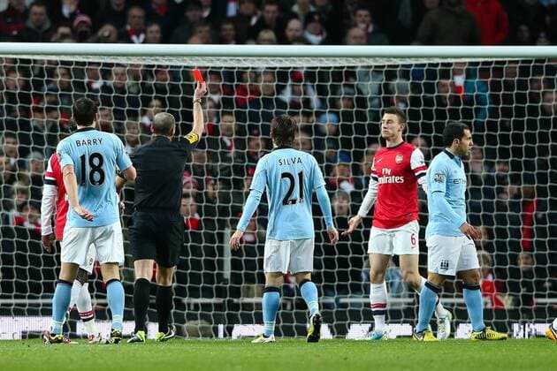Football - 2012 2013 Premier League - FC Arsenal London vs. Manchester City Arsenal s Laurent Koscielny is sent off for fouling Manchester City s Edin Dzeko in the box at the Emirates Stadium, London 