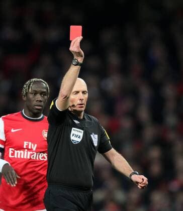 FC Arsenal London vs. Manchester City . . 13.01.13 Referee Mike Dean shows a red card to Laurent Koscielny (A) and sends him off. 