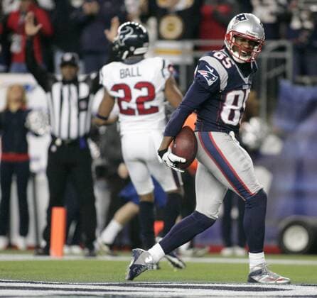 New England Patriots wide receiver Brandon Lloyd (85) smiles as he marches into the end zone on a five-yard touchdown reception in the third quarter of the AFC Divisional Playoff against the Houston Texans at Gillette Stadium Foxborough, Massachusetts on January 13, 2013. The Patriots defeated the Texans 41-28.  BOS2013011304