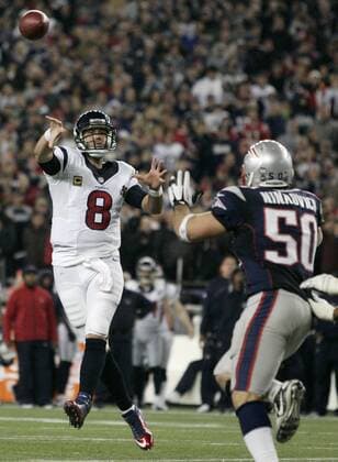 Houston Texans quarterback Matt Schaub (8) makes a pass while under pressure from New England Patriots linebacker Rob Ninkovich (50) on an extra point in the third quarter of the AFC Divisional Playoff against the Houston Texans at Gillette Stadium Foxborough, Massachusetts on January 13, 2013. The Patriots defeated the Texans 41-28.  BOS2013011309
