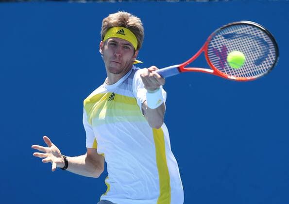 Australian Open 2013, Melbourne Park,ITF Grand Slam Tennis Tournament, Cedrik-Marcel Stebe (GER),Aktion,Einzelbild,Halbkoerper,Querformat,