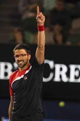 14 January 2013 : Janko TipsareviÄ? raises his finger in celebration after winning during Day 1 of the Australian Tennis open Grand Slam event at Melbourne Park, Melbourne Australia. TENNIS: JAN 14 Australian Open Icon13011466 EDITORIAL USE ONLY
