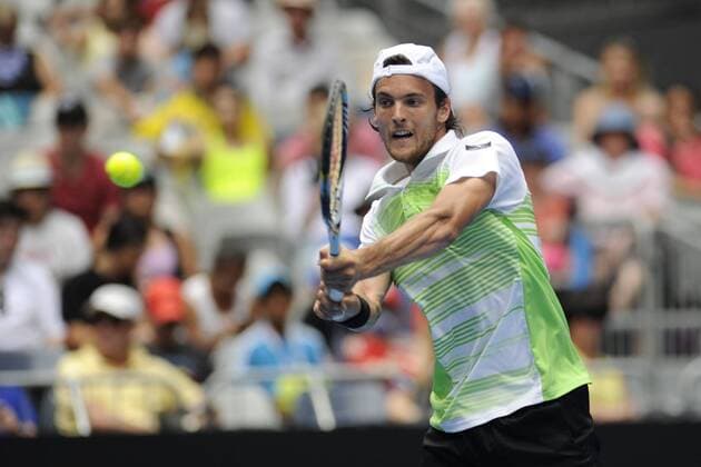 17.01.2013 Melbourne, Australia. Joao Sousa of Portugal returns a shot in his match on day four of the Australian Open from Melbourne Park. xEstherxLimx  ActionPlus11366555