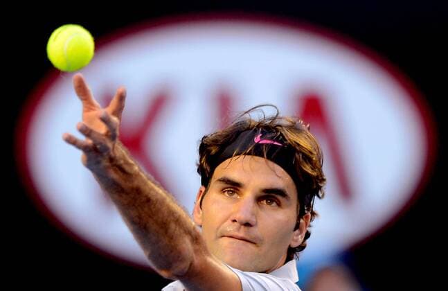 Roger Federer of Switzerland serves the ball during their third round men s singles match at the Australian Open tennis tournament in Melbourne, Australia, Jan. 19, 2013. (Xinhua Chen Xiaowei) (lrz) AUSTRALIA-MELBOURNE-TENNIS-MEN S SINGLES 