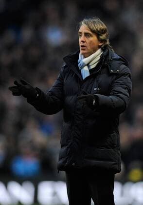 Roberto Mancini manager of Manchester City reacts on the touchline - Barclays Premier League - Manchester City vs FC Fulham - Etihad Stadium - Manchester - 13 01 13 - Picture Simon Bellis Sportimage EDITORIAL USE ONLY. No use with unauthorised audio, video, data, fixture lists, club league logos or live services. Online in-match use limited to 120 images, no video emulation. No use in betting, games or single club league player publications.