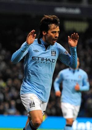David Silva of Manchester City celebrates scoring his and city s second goal - Barclays Premier League - Manchester City vs FC Fulham - Etihad Stadium - Manchester - 13 01 13 - Picture Simon Bellis Sportimage EDITORIAL USE ONLY. No use with unauthorised audio, video, data, fixture lists, club league logos or live services. Online in-match use limited to 120 images, no video emulation. No use in betting, games or single club league player publications.