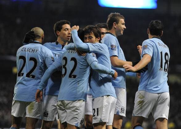 David Silva of Manchester City celebrates scoring his and city s second goal - Barclays Premier League - Manchester City vs FC Fulham - Etihad Stadium - Manchester - 13 01 13 - Picture Simon Bellis Sportimage EDITORIAL USE ONLY. No use with unauthorised audio, video, data, fixture lists, club league logos or live services. Online in-match use limited to 120 images, no video emulation. No use in betting, games or single club league player publications.