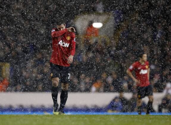 Manchester United ManU s Robin Van Persie looks on dejected..Tottenham Hotspur v Manchester United ManU - Barclays Premier League - White Hart Lane, London- 20 01 13 - Picture David Klein Sportimage EDITORIAL USE ONLY. No use with unauthorised audio, video, data, fixture lists, club league logos or live services. Online in-match use limited to 120 images, no video emulation. No use in betting, games or single club league player publications.