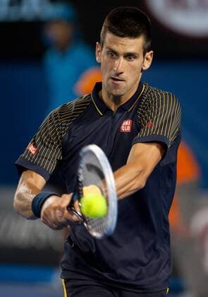 Novak Djokovic of Serbia competes during his fourth round men s singles match on the seventh day of 2013 Australian Open tennis tournament in Melbourne, Australia, Jan. 20, 2013. Novak Djokovic won 3-2. (Xinhua Bai Xue) (ql) AUSTRALIA-MELBOURNE-TENNIS-MEN S SINGLES 