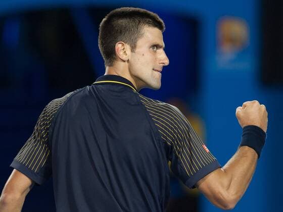Novak Djokovic of Serbia celebrates during his fourth round men s singles match on the seventh day of 2013 Australian Open tennis tournament in Melbourne, Australia, Jan. 20, 2013. Novak Djokovic won 3-2. (Xinhua Bai Xue) (ql) AUSTRALIA-MELBOURNE-TENNIS-MEN S SINGLES 