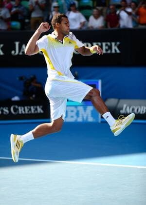 Australian Open 2013, Melbourne Park,ITF Grand Slam Tennis Tournament,Jo-Wilfried Tsonga (FRA) springt hoch und jubelt nach seinem Sieg,Jubel,Emotion,Freude,Einzelbild,Ganzkoerper,Hochformat,