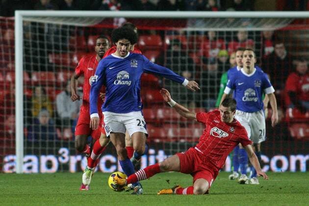 Football - 2012 2013 Premier League - FC Southampton vs FC Everton - Southampton s Morgan Schneiderlin tackles Marouane Fellaini of Everton at St Mary s Stadium Southampton 