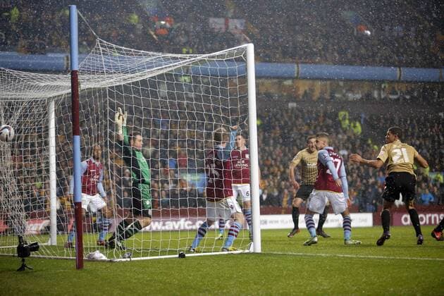 James Hanson s header hits the back of the net for Bradford s first goal of the game - Football - Aston Villa v Bradford City - Capital One Cup semi final second leg - Villa Park - Birmingham - Season 12 13 - 22.01.2013..Mandatory credit: Malcolm Couzens Sportimage EDITORIAL USE ONLY. No use with unauthorised audio, video, data, fixture lists, club league logos or live services. Online in-match use limited to 120 images, no video emulation. No use in betting, games or single club league player publications.