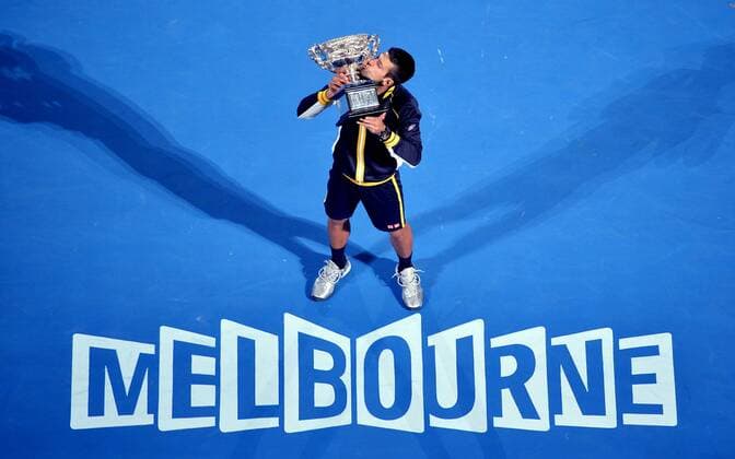 (130127) -- MELBOURNE, Jan. 27, 2013 -- Novak Djokovic of Serbia kisses the trophy during the awarding ceremony after the men s singles final at the 2013 Australian Open tennis tournament in Melbourne, Australia, Jan. 27, 2013. Novak Djokovic won 3-1 to claim the champion. AUSTRALIA-MELBOURNE-TENNIS-MEN S SINGLES-FINAL 