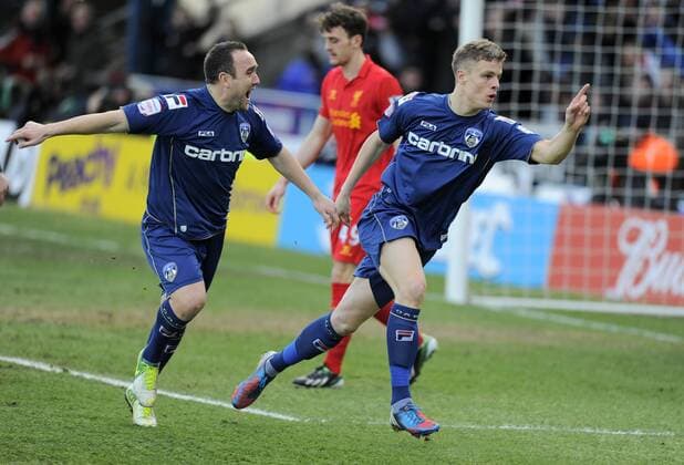 Matt Smith of Oldham Athletic (r) turns to celebrates scoring the first goal - FA Cup 4th Round - Oldham Athletic vs Liverpool - Boundary Park Stadium - Oldham - 27 01 13 - Picture Simon Bellis Sportimage EDITORIAL USE ONLY. No use with unauthorised audio, video, data, fixture lists, club league logos or live services. Online in-match use limited to 120 images, no video emulation. No use in betting, games or single club league player publications.