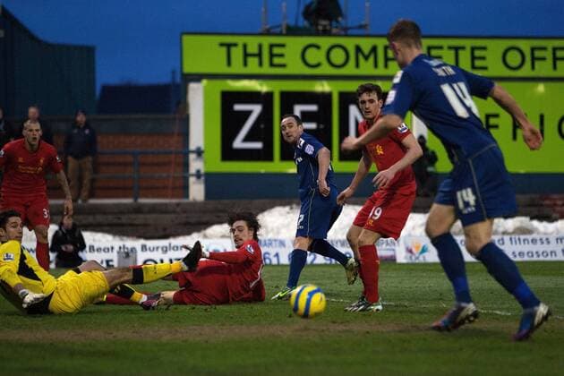 Football - 2012 2013 FA Cup Fourth Round - Oldham Athletic vs. Liverpool Oldham s Lee Croft puts the ball through for Matt Smith to score his sides second goal at Boundary Park 