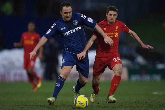 Football - 2012 2013 FA Cup Fourth Round - Oldham Athletic vs. Liverpool Oldham s Lee Croft and Joe Allen of Liverpool at Boundary Park 