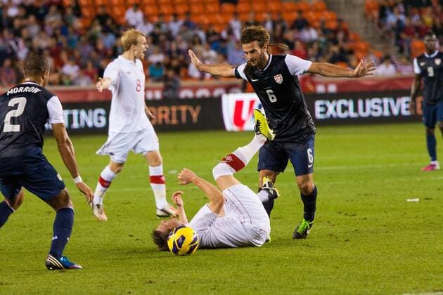 JAN 29 2013: U.S. National Soccer M Kyle Beckerman (6) trips Canadian National Soccer M Terry Dunfield (7) during a friendly match at BBVA Compass Stadium in Houston, TX. SOCCER: JAN 29 International Friendly - Canada at USA Icon20130129018 EDITORIAL USE ONLY