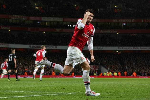 Football - 2012 2013 Premier League - Arsenal FC vs Liverpool FC Olivier Giroud of Arsenal scores at the Emirates Stadium, London 
