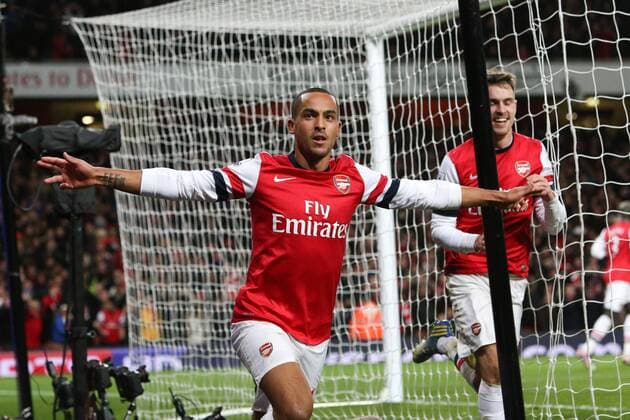 Football - 2012 2013 Premier League - Arsenal FC vs Liverpool FC Theo Walcott of Arsenal scores at the Emirates Stadium, London 