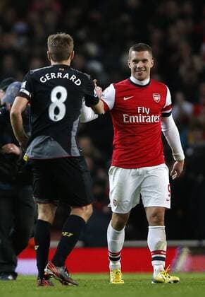 LONDON, Jan. 30, 2013 (Xinhua) -- Lukas Podolski (R) of Arsenal greets Steven Gerrard of Liverpool after the Barclays Premier League match at Emirates Stadium on January 30, 2013. The match ended with a 2-2 draw.(Xinhua Wang Lili) FOR EDITORIAL USE ONLY. NOT FOR SALE FOR MARKETING OR ADVERTISING CAMPAIGNS. NO USE WITH UNAUTHORIZED AUDIO, VIDEO, DATA, FIXTURE LISTS, CLUB LEAGUE LOGOS OR LIVE SERVICES. ONLINE IN-MATCH USE LIMITED TO 45 IMAGES, NO VIDEO EMULATION. NO USE IN BETTING, GAMES OR SINGLE CLUB LEAGUE PLAYER PUBLICATIONS. BRITAIN-LONDON-SOCCER-PREMIER LEAGUE-ARSENAL VS LIVERPOOL 