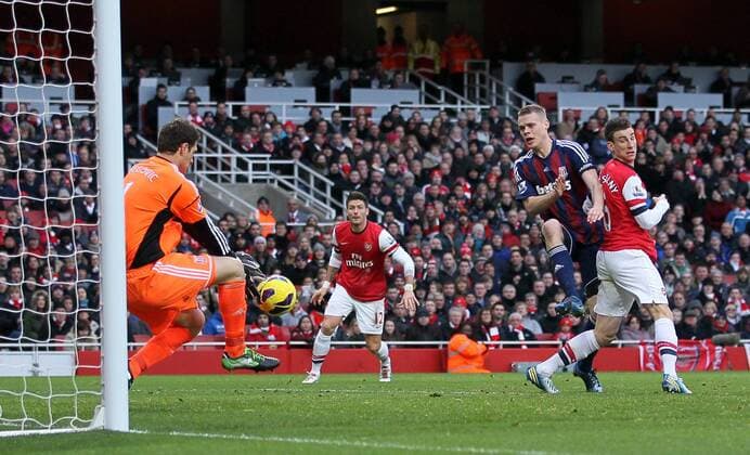 Arsenal s Laurant Koscielny sees his header saved by Stoke s Asmir Begovic..Arsenal v Stoke - Barclays Premier League - Emirates Stadium, London- 02 02 13 - Picture David Klein Sportimage EDITORIAL USE ONLY. No use with unauthorised audio, video, data, fixture lists, club league logos or live services. Online in-match use limited to 120 images, no video emulation. No use in betting, games or single club league player publications.