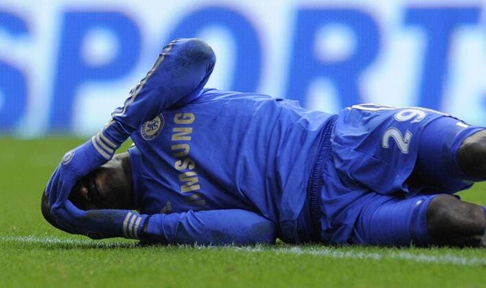 Demba Ba of Chelsea goes down holding his face - Barclays Premier League - Newcastle Utd vs Chelsea - St. James Park - Newcastle - 02 02 13 - Picture Richard Lee Sportimage EDITORIAL USE ONLY. No use with unauthorised audio, video, data, fixture lists, club league logos or live services. Online in-match use limited to 120 images, no video emulation. No use in betting, games or single club league player publications.