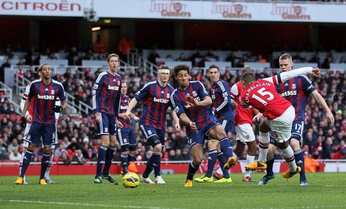 Arsenal s Alex Oxlade-Chamberlain finds himself surrounded by Stoke players..Arsenal v Stoke - Barclays Premier League - Emirates Stadium, London- 02 02 13 - Picture David Klein Sportimage EDITORIAL USE ONLY. No use with unauthorised audio, video, data, fixture lists, club league logos or live services. Online in-match use limited to 120 images, no video emulation. No use in betting, games or single club league player publications.