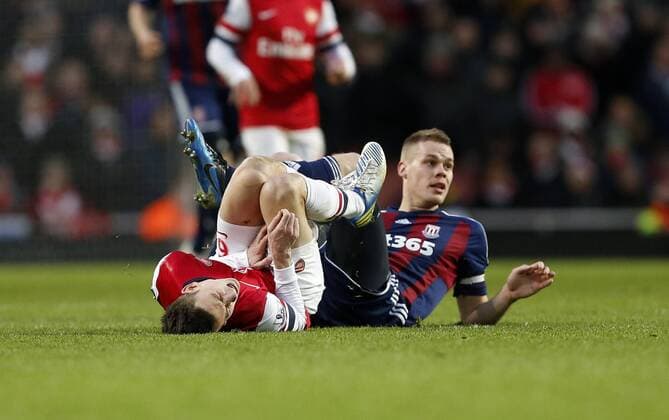 Stoke s Ryan Shawcross gets booked for this tackle on Arsenal s Laurent Koscielny..Arsenal v Stoke - Barclays Premier League - Emirates Stadium, London- 02 02 13 - Picture David Klein Sportimage EDITORIAL USE ONLY. No use with unauthorised audio, video, data, fixture lists, club league logos or live services. Online in-match use limited to 120 images, no video emulation. No use in betting, games or single club league player publications.
