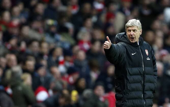 Arsenal s Arsene Wenger mockingly gestures to the Stoke bench..Arsenal v Stoke - Barclays Premier League - Emirates Stadium, London- 02 02 13 - Picture David Klein Sportimage EDITORIAL USE ONLY. No use with unauthorised audio, video, data, fixture lists, club league logos or live services. Online in-match use limited to 120 images, no video emulation. No use in betting, games or single club league player publications.