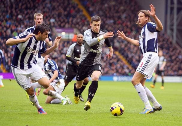 Gareth Bale cuts his way through Jonas Olsson and Goran Popov- Barclays Premier League - West Bromwich Albion vs Tottenham Hotspur - The Hawthorns -West Bromwich - 3rd February 2013 - Credit Paul Bradbury Sportimage EDITORIAL USE ONLY. No use with unauthorised audio, video, data, fixture lists, club league logos or live services. Online in-match use limited to 120 images, no video emulation. No use in betting, games or single club league player publications.