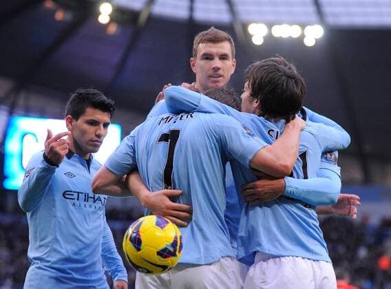 Edin Dzeko of Manchester City celebrates scoring the first goal - Barclays Premier League - Manchester City vs Liverpool - Etihad Stadium - Manchester - 03 02 13 - Picture Simon Bellis Sportimage EDITORIAL USE ONLY. No use with unauthorised audio, video, data, fixture lists, club league logos or live services. Online in-match use limited to 120 images, no video emulation. No use in betting, games or single club league player publications.