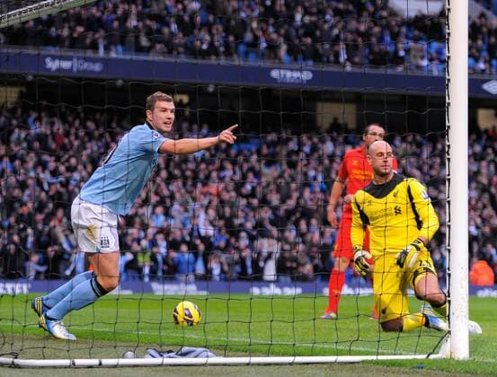 Edin Dzeko of Manchester City celebrates scoring the first goal - Barclays Premier League - Manchester City vs Liverpool - Etihad Stadium - Manchester - 03 02 13 - Picture Simon Bellis Sportimage EDITORIAL USE ONLY. No use with unauthorised audio, video, data, fixture lists, club league logos or live services. Online in-match use limited to 120 images, no video emulation. No use in betting, games or single club league player publications.