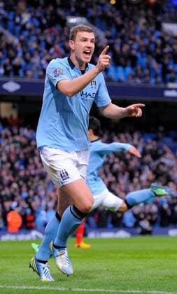 Edin Dzeko of Manchester City celebrates scoring the first goal - Barclays Premier League - Manchester City vs Liverpool - Etihad Stadium - Manchester - 03 02 13 - Picture Simon Bellis Sportimage EDITORIAL USE ONLY. No use with unauthorised audio, video, data, fixture lists, club league logos or live services. Online in-match use limited to 120 images, no video emulation. No use in betting, games or single club league player publications.