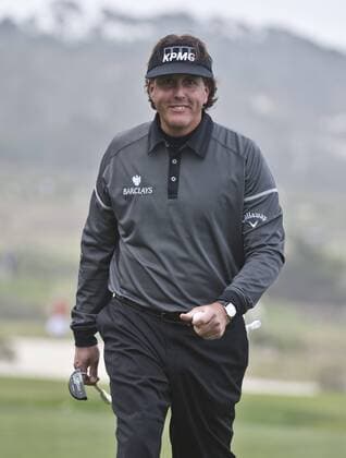 Phil Mickelson smiles after sinking his putt on the sixth green at the Monterey Peninsula Country Club in the AT&T National Pro Am in Pebble Beach, California on February 7, 2013.  SXP20130200718
