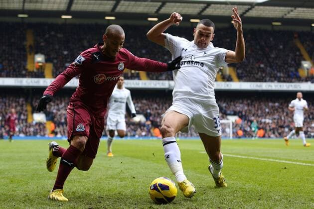 Football - 2012 2013 Premier League - Tottenham Hotspur vs. Newcastle United Tottenham s Steven Caulker and Newcastle United s Yoan Gouffran at White Hart Lane, London 