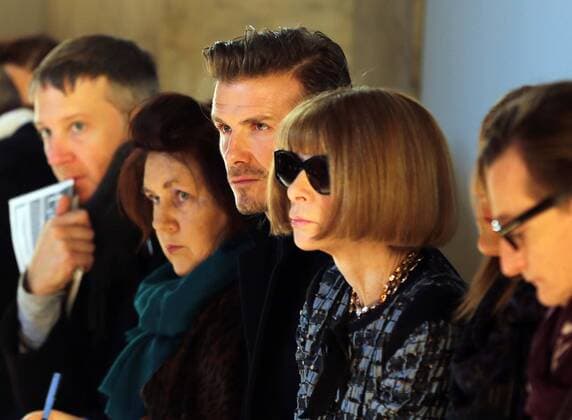 David Beckham sits next to Suzy Menkes and Anna Wintour to watch Victoria Beckham s show at New York Fashion Week for Autumn Winter 2013 , Sunday, 10th February 2013. Photo by: Stephen Lock i-Images StephenxLock i-Images  SLK
