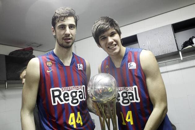 FC Barcelona Regal s Ante Tomic (l) and Marko Todorovic celebrate the victory in the Spanish Basketball King s Cup Final match.February 07,2013.  (201302101403)