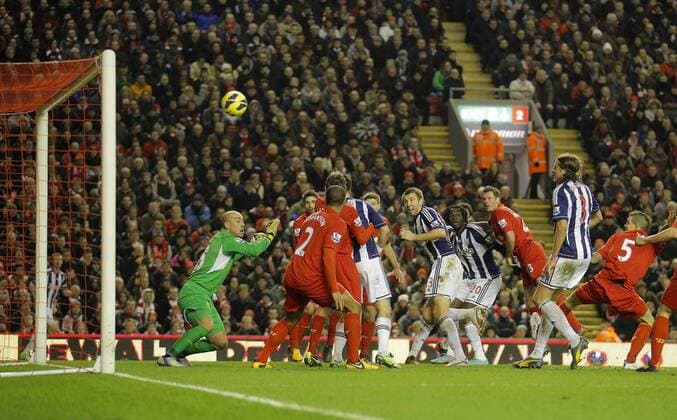 Gareth McAuley scores the first goal of the game for West Brom - Barclays Premier League - Liverpool vs West Bromwich Albion - Anfield - Liverpool 11 2 2013 Picture Malcolm Couzens Sportimage EDITORIAL USE ONLY. No use with unauthorised audio, video, data, fixture lists, club league logos or live services. Online in-match use limited to 120 images, no video emulation. No use in betting, games or single club league player publications.
