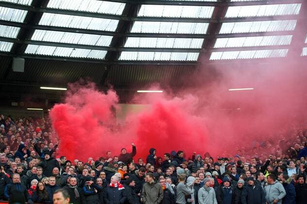 PROPAGANDA20130113 Football - soccer: Barclays Premier League, Liverpool FC, Liverpool supporters celebrate their side s goal as a red smoke bomb goes off during the Premiership match at Old Trafford. xHOCHxZWEIx xPropagandax 