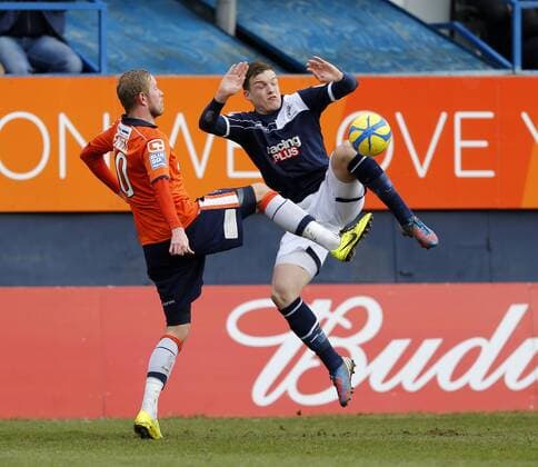 Luton s Scott Rendell tussles with Millwall s Shane Lowry..Luton Town v Millwall - FA Cup 5th Round - Kenilworth Road, Luton- 16 02 13 - Picture David Klein Sportimage EDITORIAL USE ONLY. No use with unauthorised audio, video, data, fixture lists, club league logos or live services. Online in-match use limited to 120 images, no video emulation. No use in betting, games or single club league player publications.