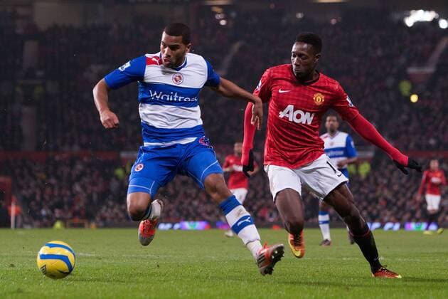 Football - 2012 2013 FA Cup - Fifth Round: Manchester United vs. Reading Danny Welbeck of Manchester United is kept at bay by Adrian Mariappa of Reading at Old Trafford 