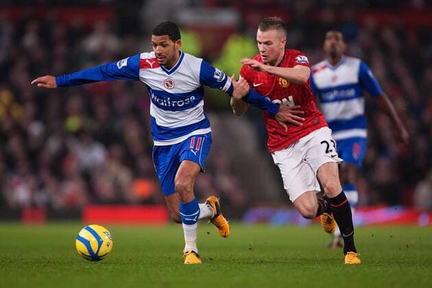 Football - 2012 2013 FA Cup - Fifth Round: Manchester United vs. Reading Jobi McAnuff of Reading fends off Tom Cleverley of Manchester United at Old Trafford 