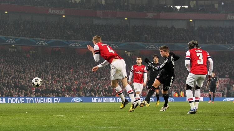 Munich s Toni Kroos scoring his sides opening goal..Arsenal v Bayern Munich - Champions League Second Round, First Leg- Emirates Stadium, London- 19 02 13 - Picture David Klein Sportimage EDITORIAL USE ONLY. No use with unauthorised audio, video, data, fixture lists, club league logos or live services. Online in-match use limited to 120 images, no video emulation. No use in betting, games or single club league player publications.