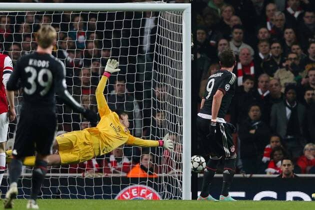 Football - 2012 2013 Champions League - Round of 16, First Leg: Arsenal vs. Bayern Munich Bayern Munich s Mario MandÅ¾uki? scrapes the post with a header at the Emirates Stadium, London 